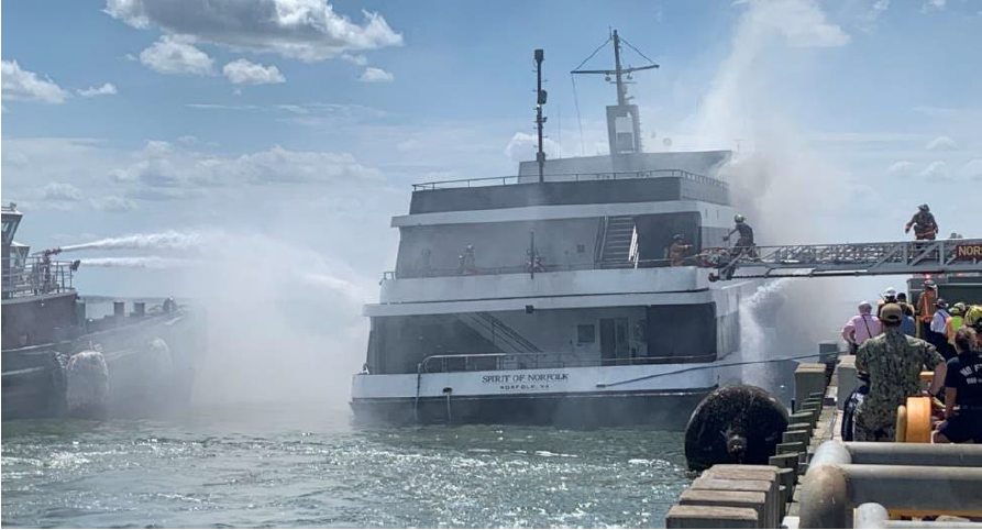 Firefighters boarding the Spirit of Norfolk. (Source: Coast Guard)