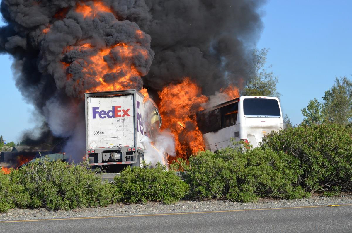 FedEx Freight truck-tractor double trailers and Silverado motorcoach postcrash.