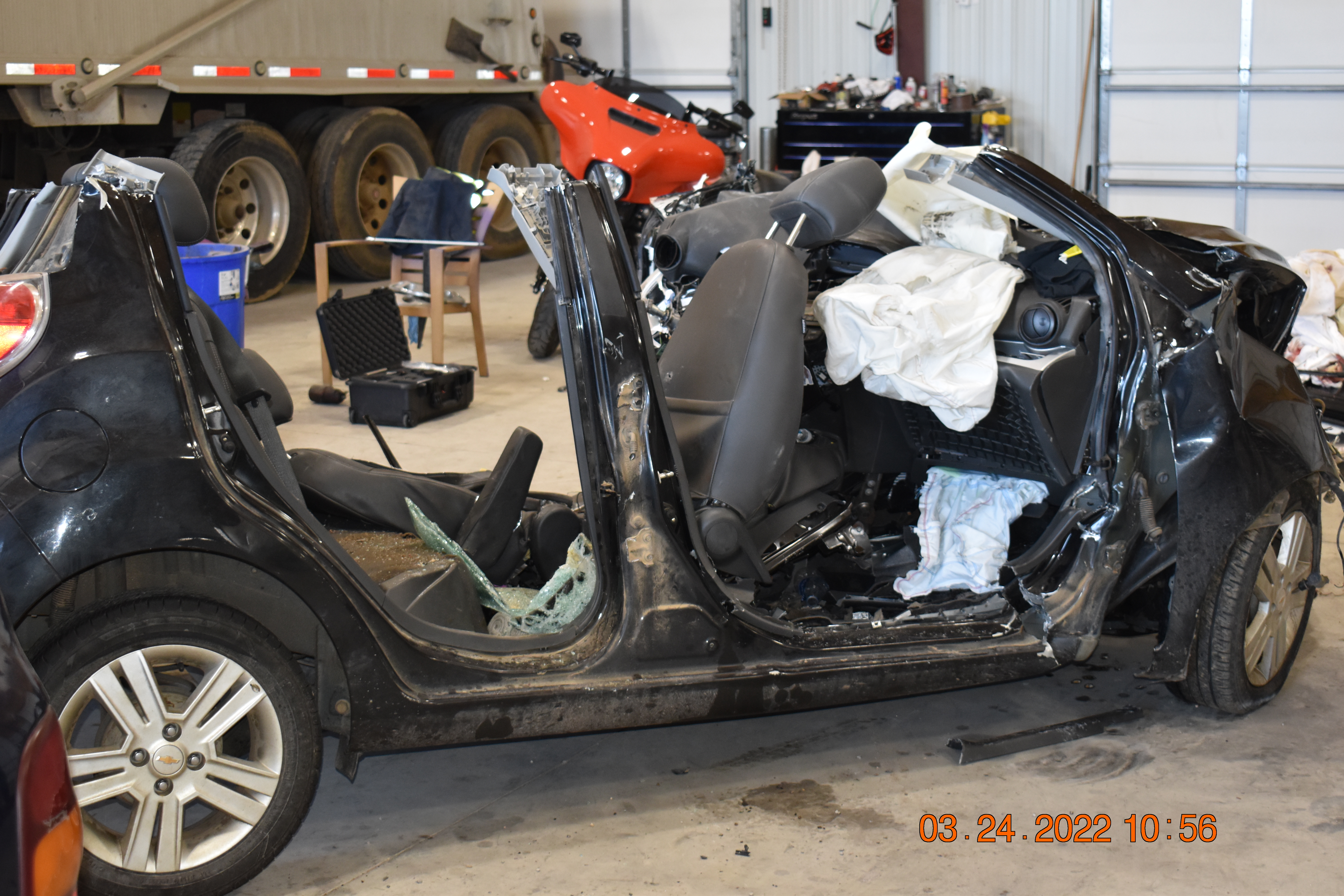 Post crash photograph of damage to passenger car in Tishomingo crash